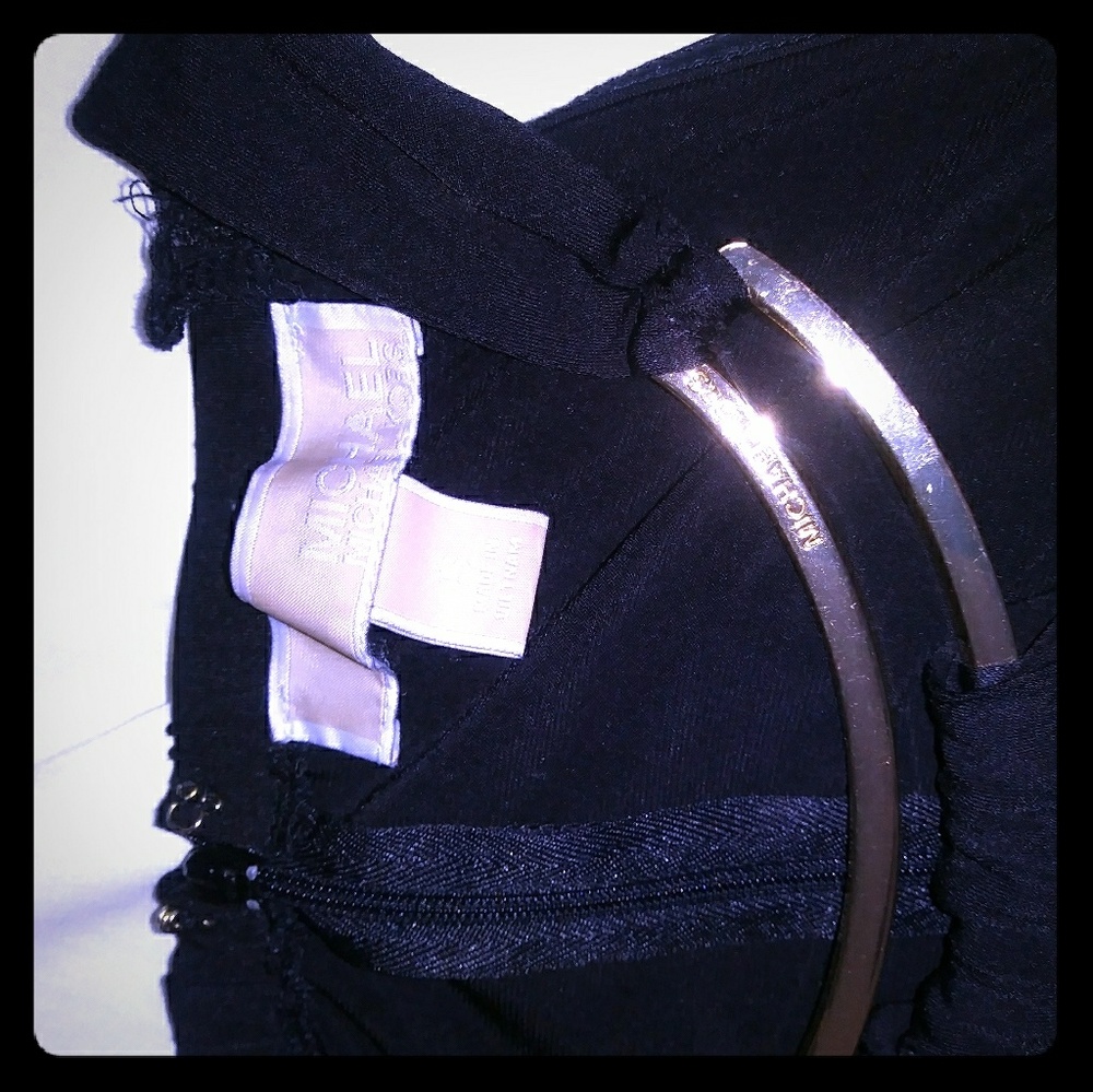 Black jumper with gold collar detail